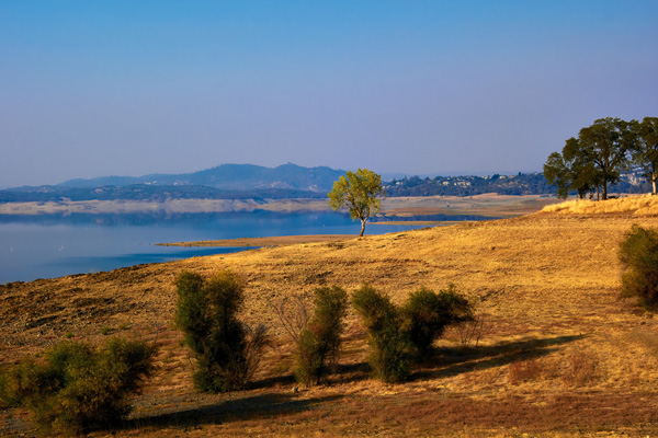 Folsom Lake in California surrounded by dry grass
